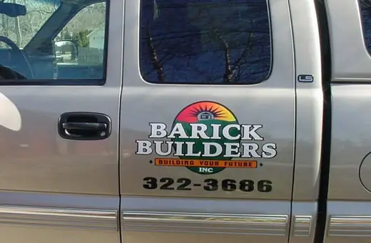 Silver pickup with contractor door lettering