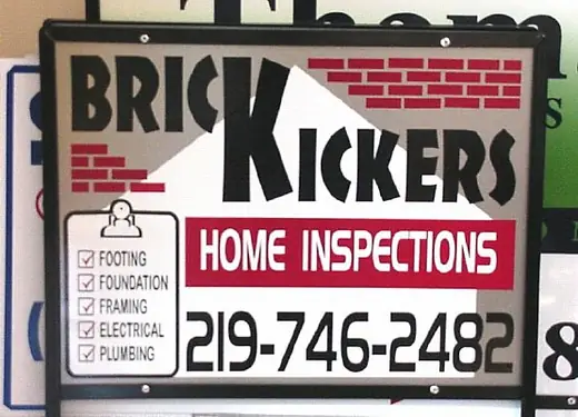 Home inspection business sign with a brick-wall graphic
