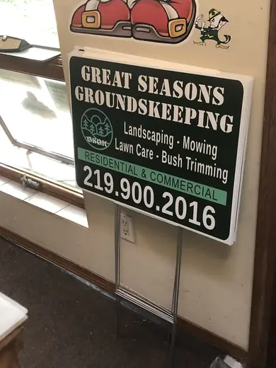 Landscaping yard sign in a metal frame
