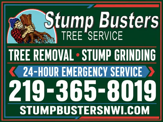 Green and white tree removal business sign with a large 219 phone number
